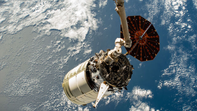 Northrop Grumman's Cygnus spacecraft is pictured at the International Space Station earlier this year. One of its two solar arrays did not deploy on this flight. 